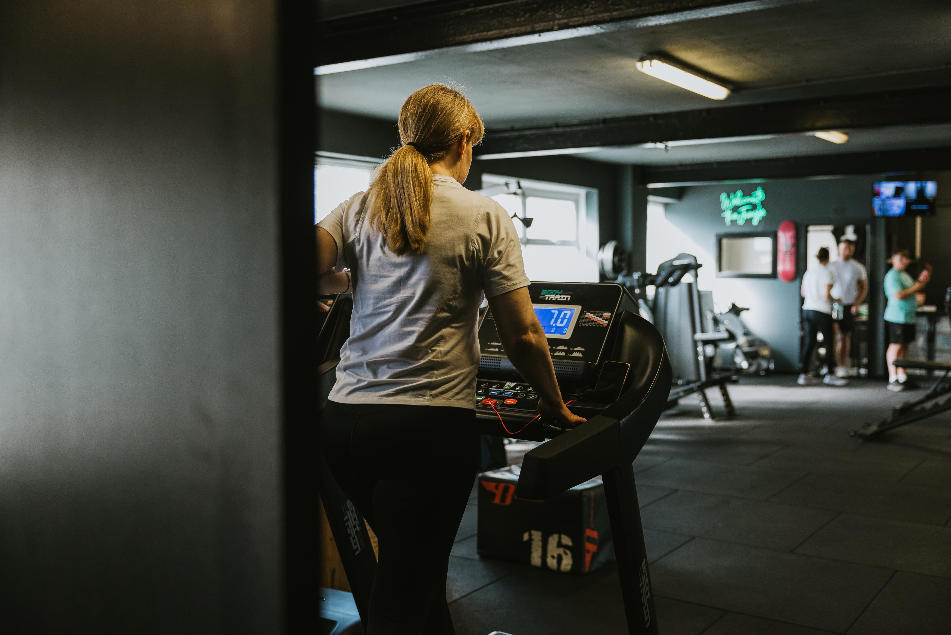 Member exercising on treadmill
