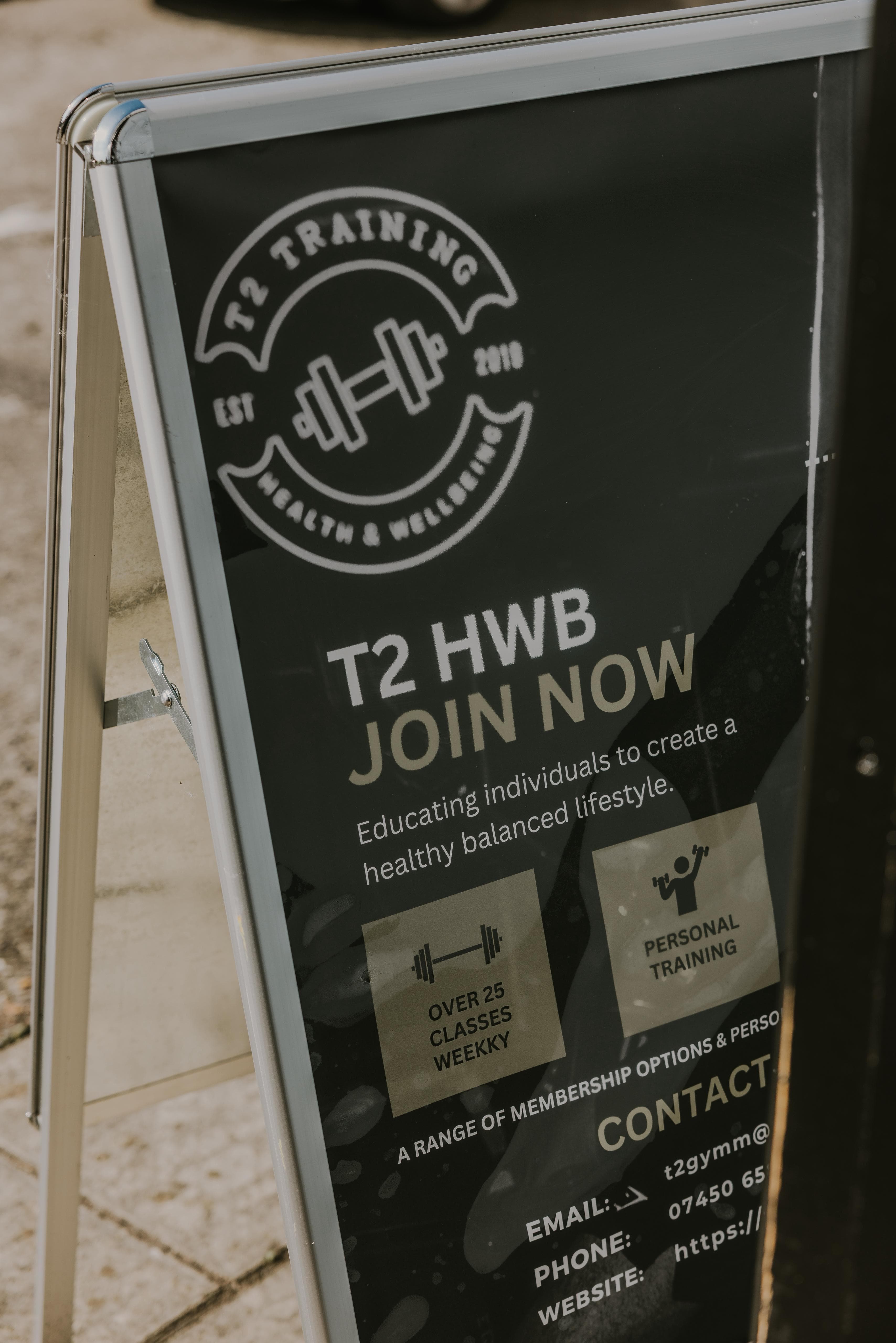T2 gym pavement sign