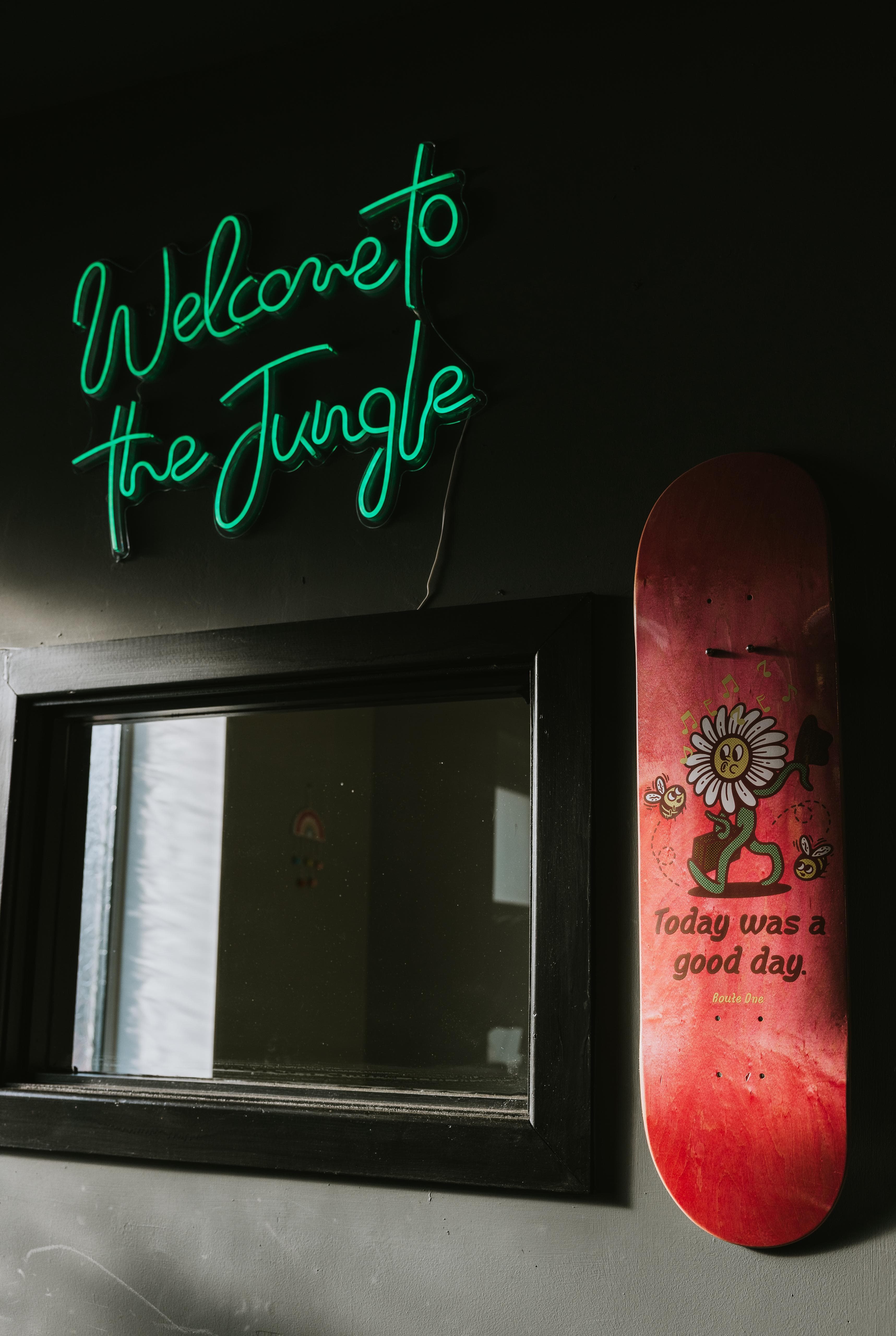 Welcome To The Jungle neon sign inside T2 gym
