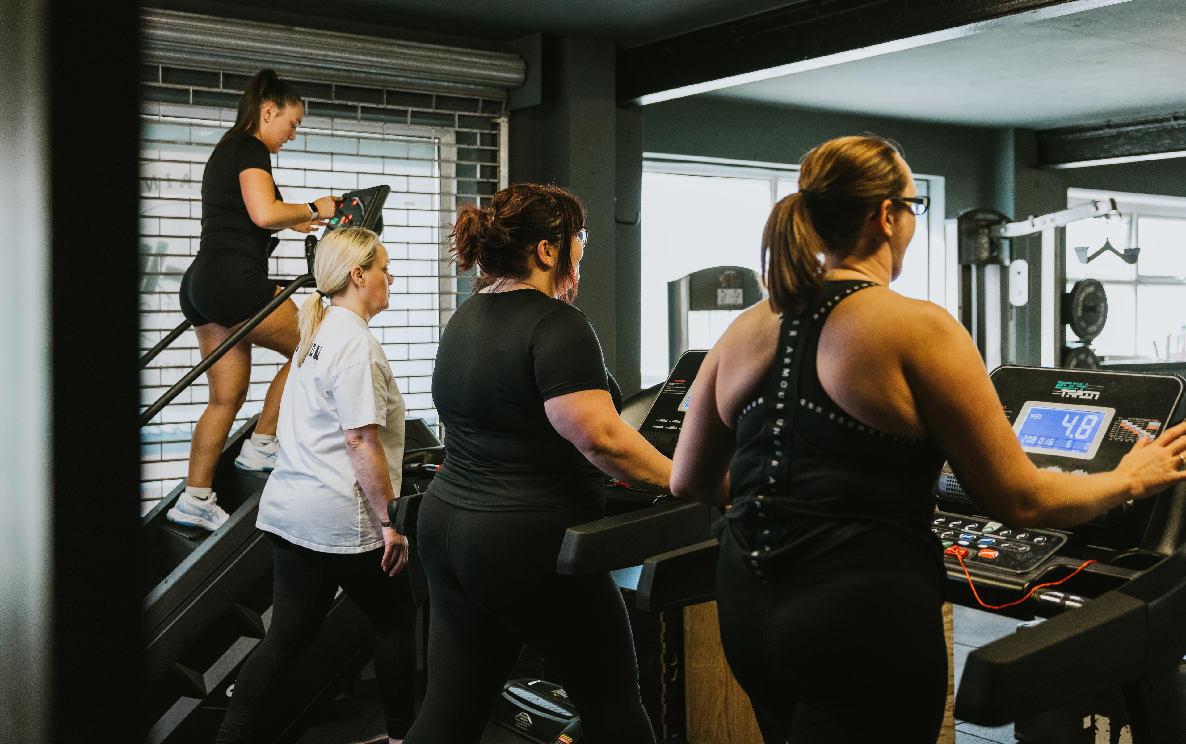 Group training session on cardio equipment
