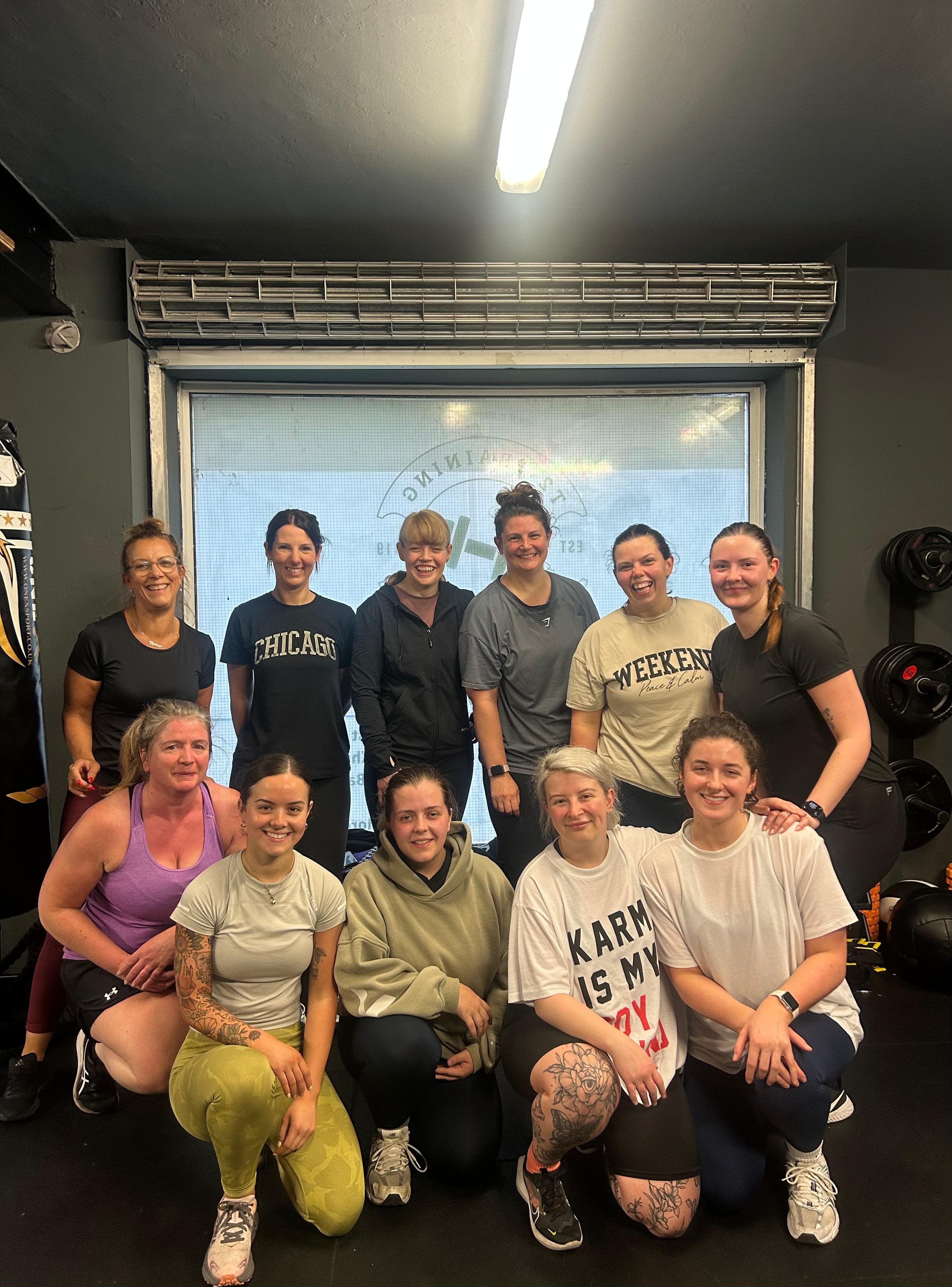 Indoor group photo of happy clients after group session